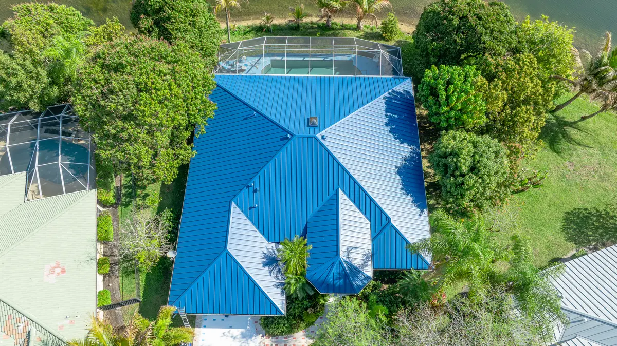 Blue metal roof with screened pool enclosure