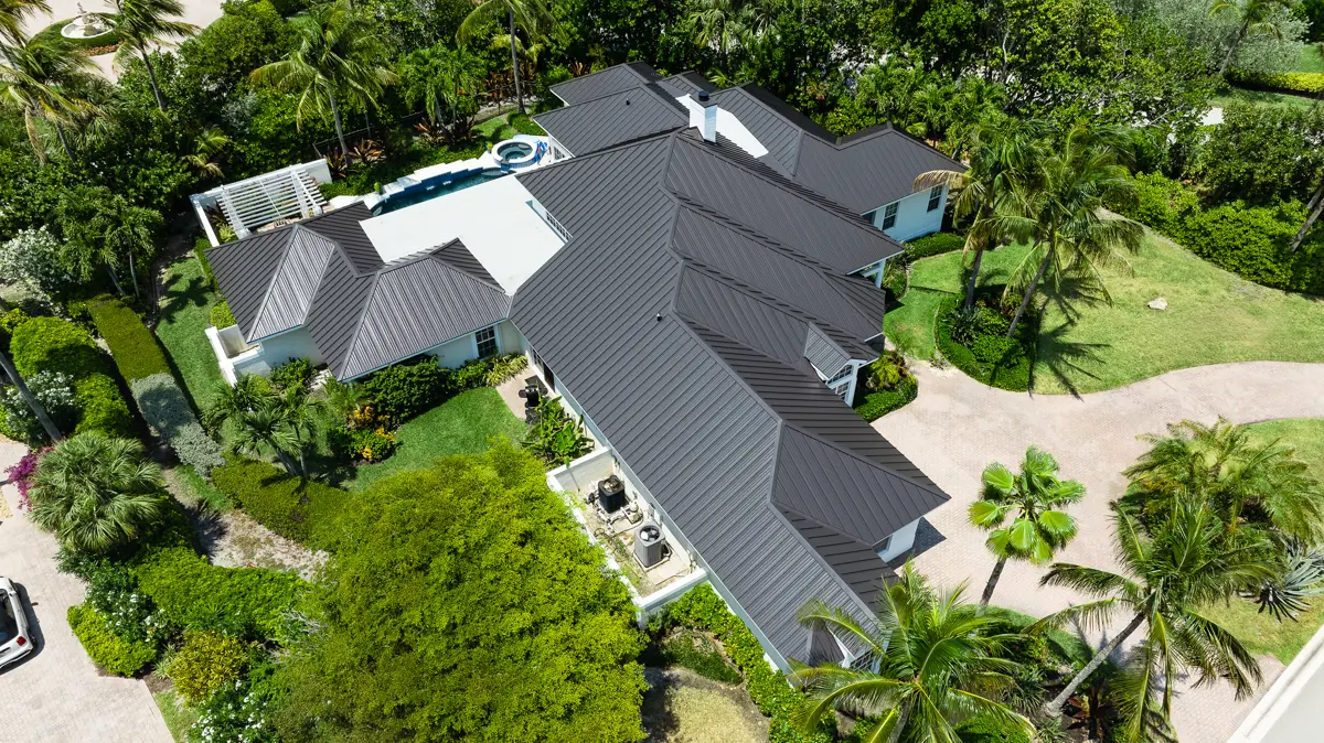 Modern residence with charcoal standing seam metal roof from above