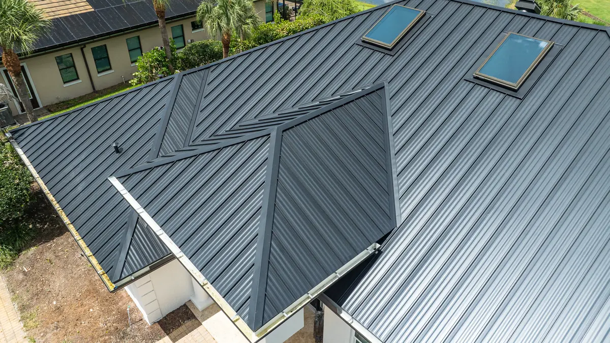 Hand-formed flashing on a charcoal standing seam roof