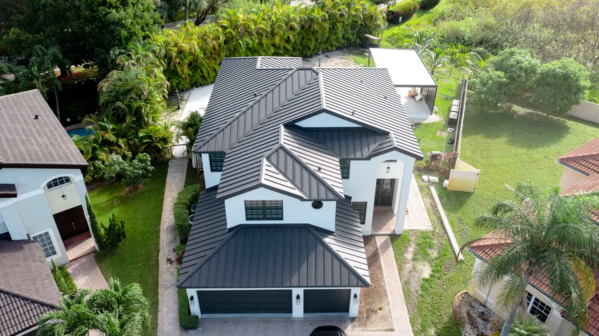 Modern two-story home with dark metal roof