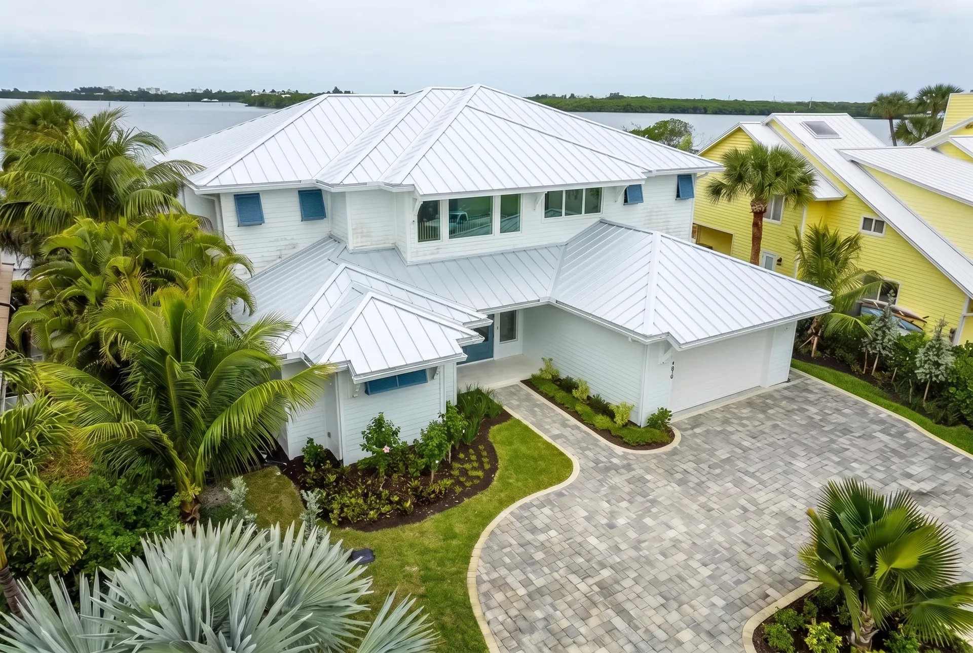 The finished white standing seam metal roof